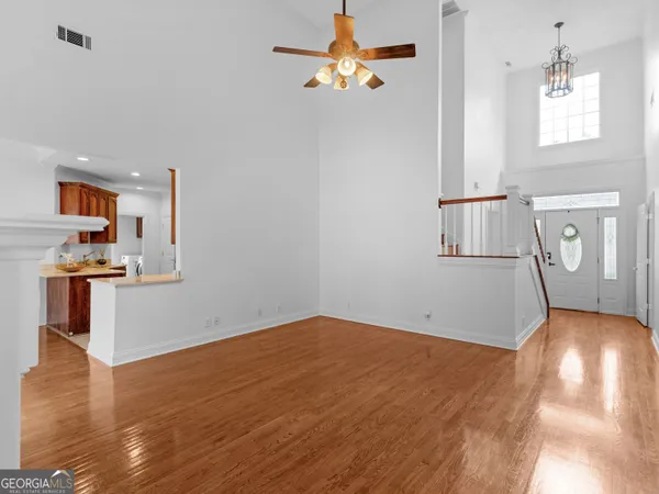 a kitchen with granite countertop a sink stainless steel appliances and cabinets