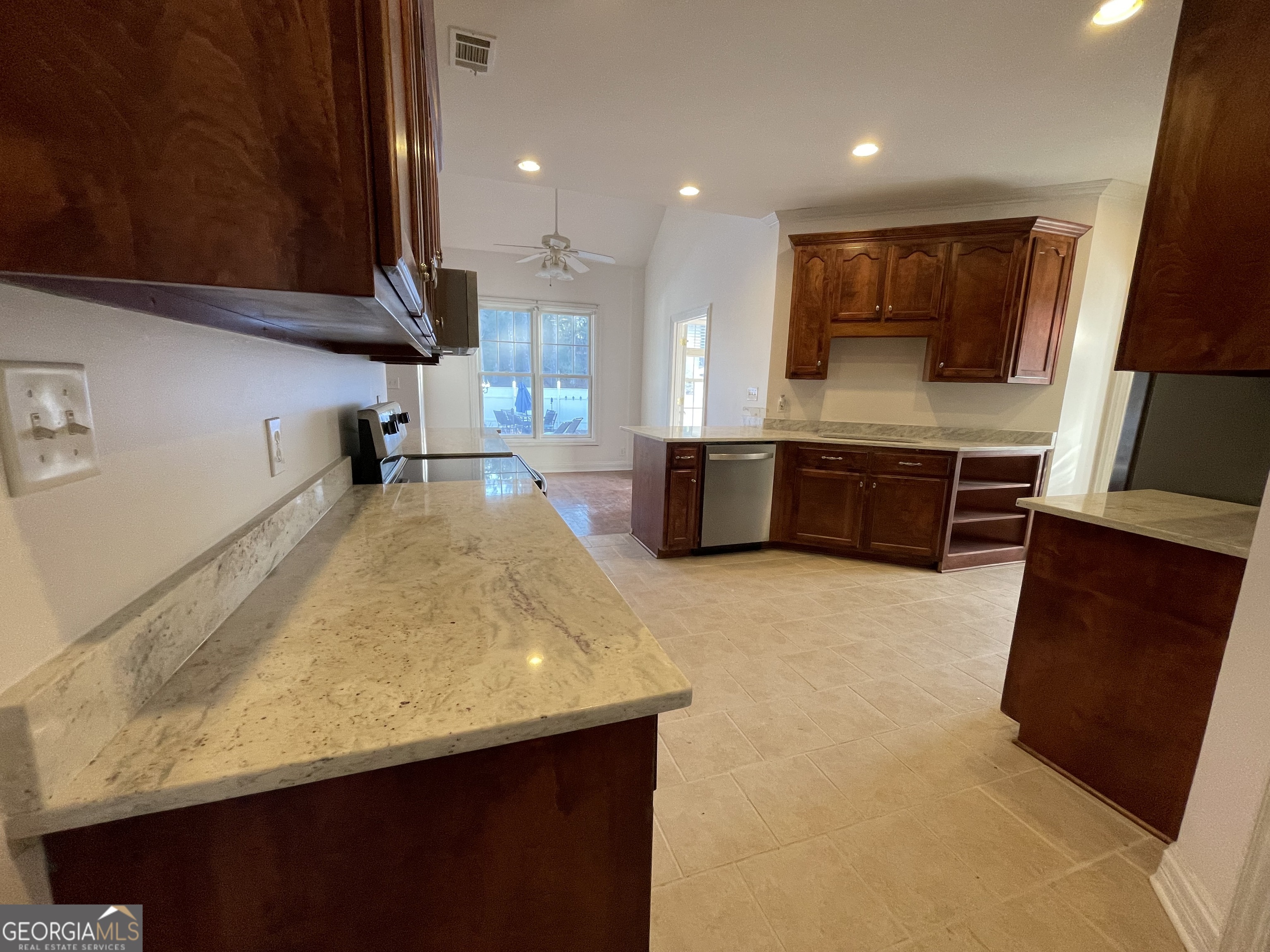 155 Rocky Way Williamson, GA 30292 - Photo 27 of 56 a large kitchen with a large stove top oven a sink a counter space and cabinets
