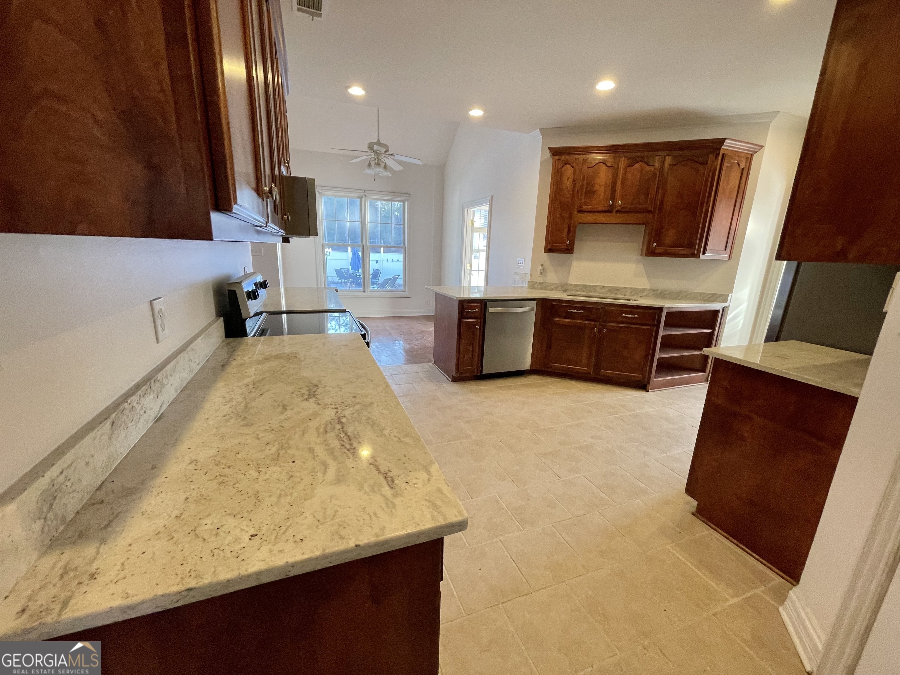 155 Rocky Way Williamson, GA 30292 - Photo 30 of 56 a large kitchen with a large stove top oven a sink a counter space and cabinets