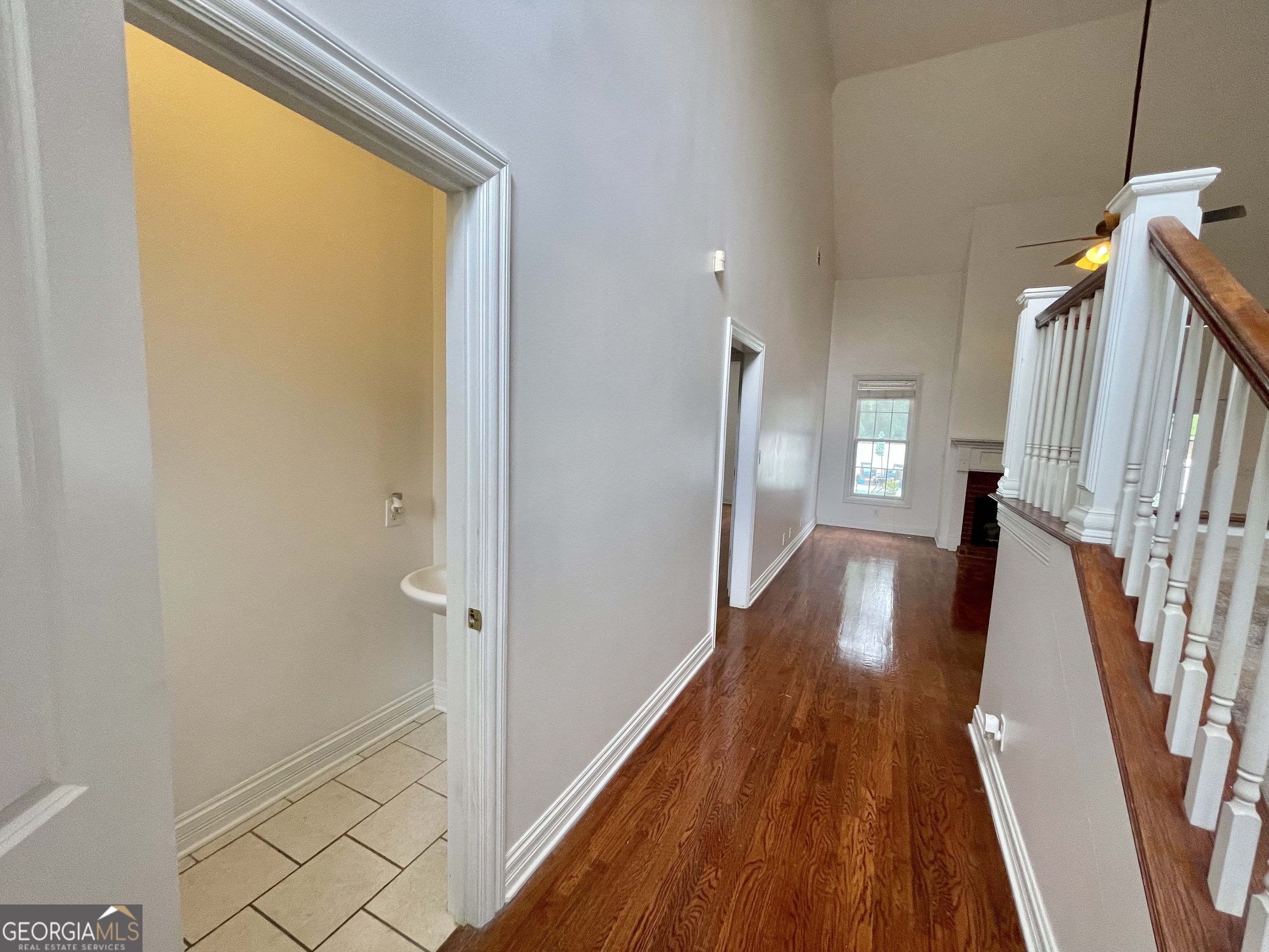 155 Rocky Way Williamson, GA 30292 - Photo 34 of 56 a view of a hallway with wooden floor and staircase