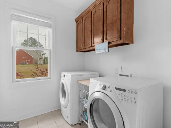 a bathroom with a tub and a shower