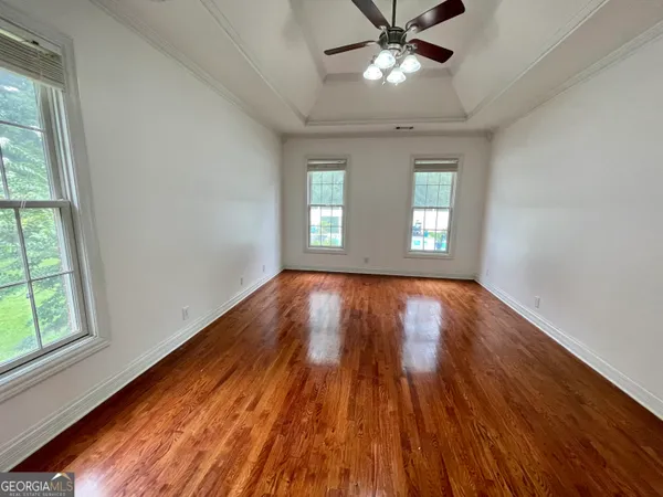 a bedroom with furniture and window
