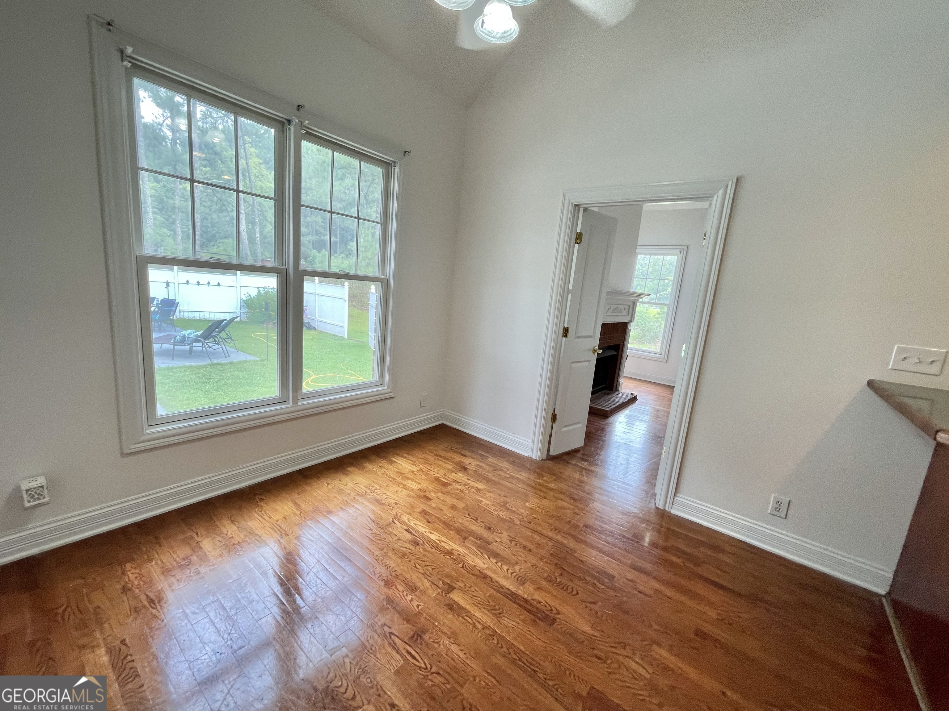 155 Rocky Way Williamson, GA 30292 - Photo 41 of 56 an empty room with wooden floor and windows