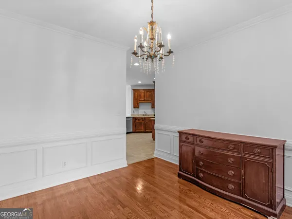 a view of a house with a yard patio and swimming pool