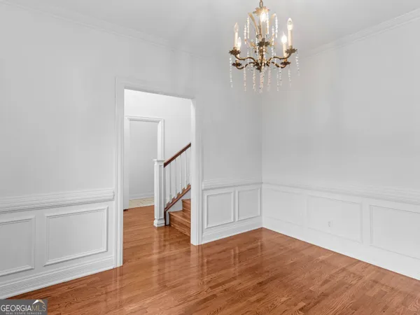 a view of an empty room with stairs