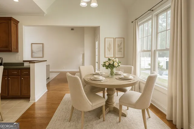 a view of empty room with fireplace and wooden floor