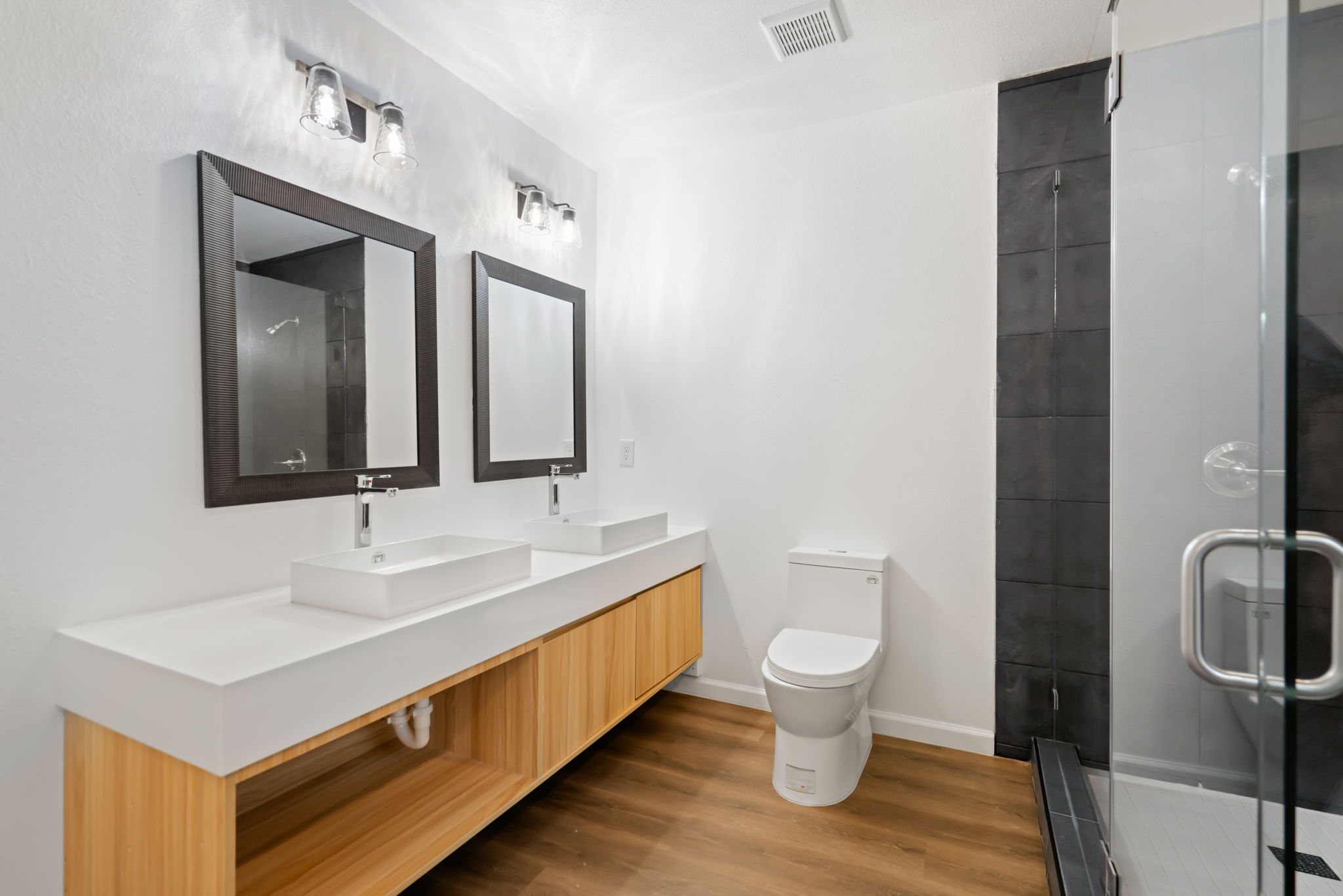 3501 Grayson Lane Austin, TX 78722 - Photo 14 of 23 a bathroom with a toilet sink and mirror