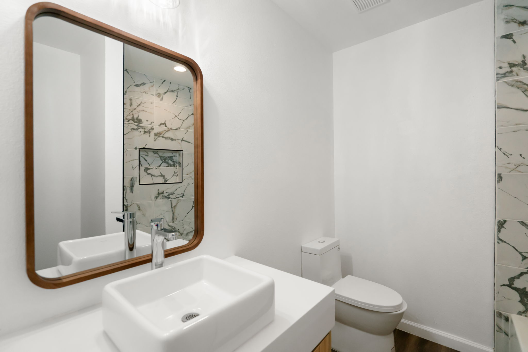 3501 Grayson Lane Austin, TX 78722 - Photo 16 of 23 a bathroom with a sink a toilet and shower