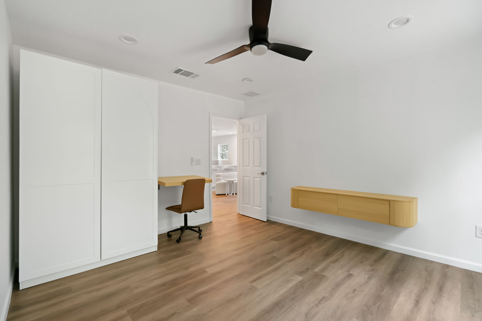 3501 Grayson Lane Austin, TX 78722 - Photo 17 of 23 a view of a workspace with furniture and wooden floor