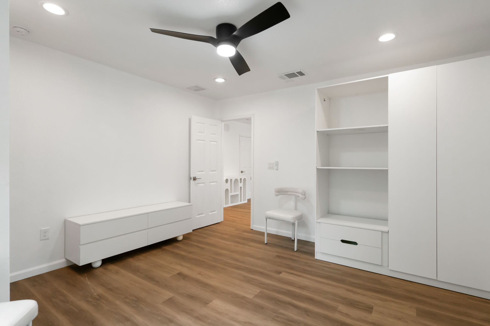 3501 Grayson Lane Austin, TX 78722 - Photo 18 of 23 a view of room with wooden floor and ceiling fan