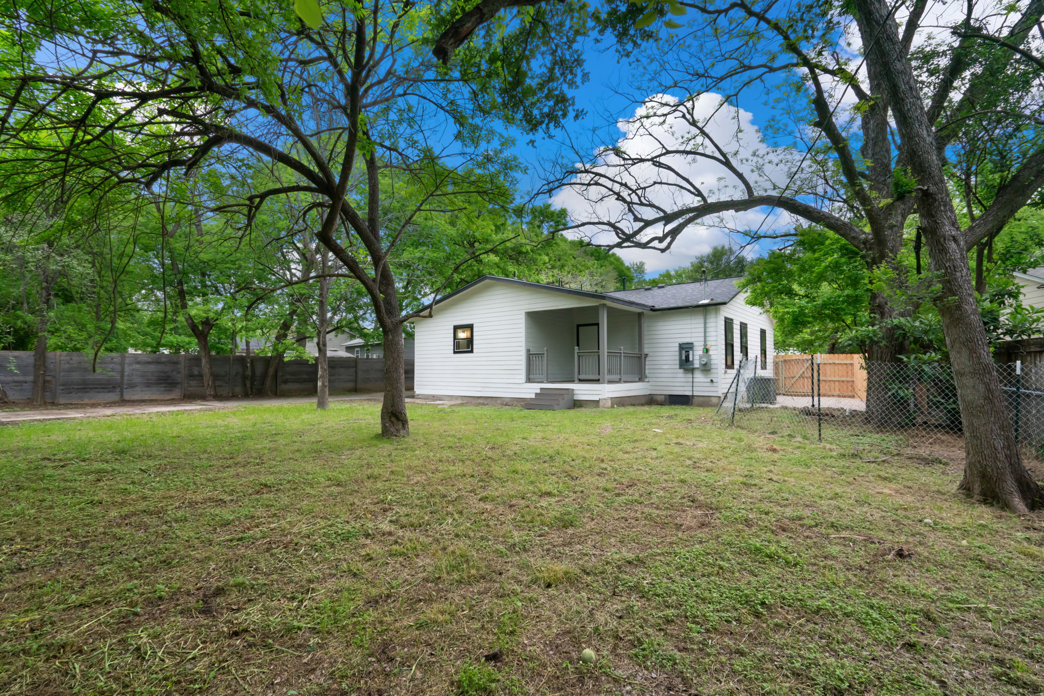 3501 Grayson Lane Austin, TX 78722 - Photo 23 of 23 a backyard of a house with lots of green space