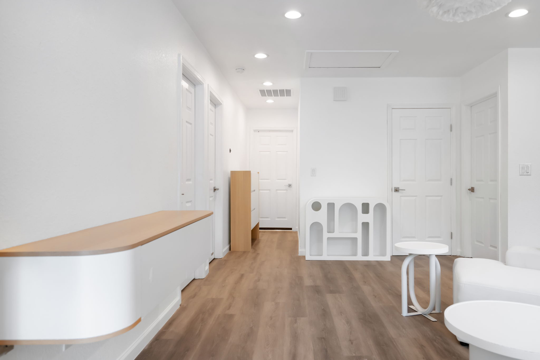 3501 Grayson Lane Austin, TX 78722 - Photo 6 of 23 a view of an empty room with wooden floor and a bathroom