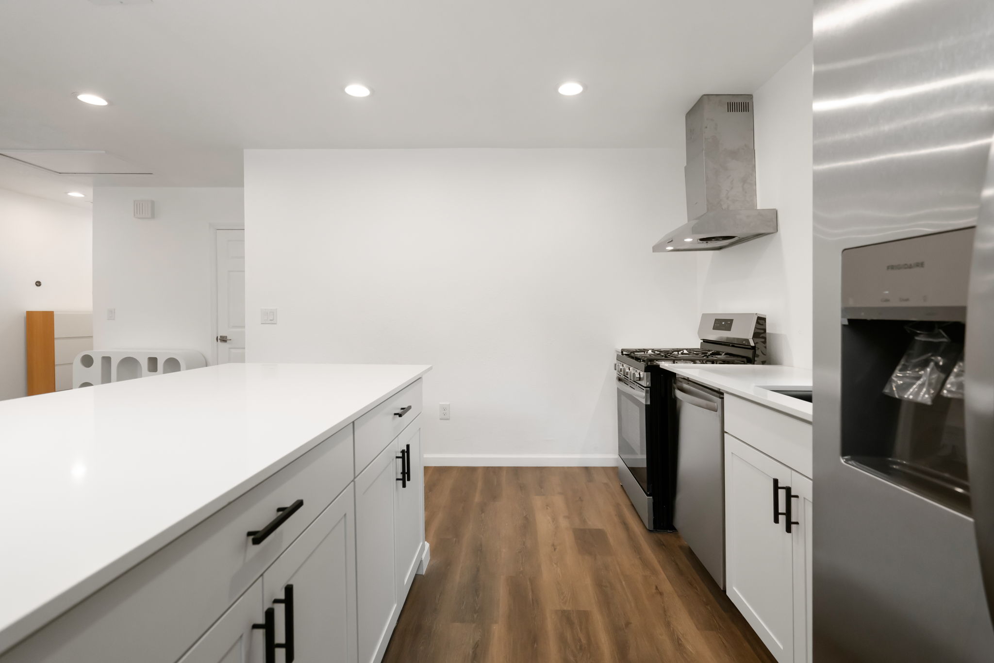 3501 Grayson Lane Austin, TX 78722 - Photo 10 of 23 a kitchen with a sink and wooden floor