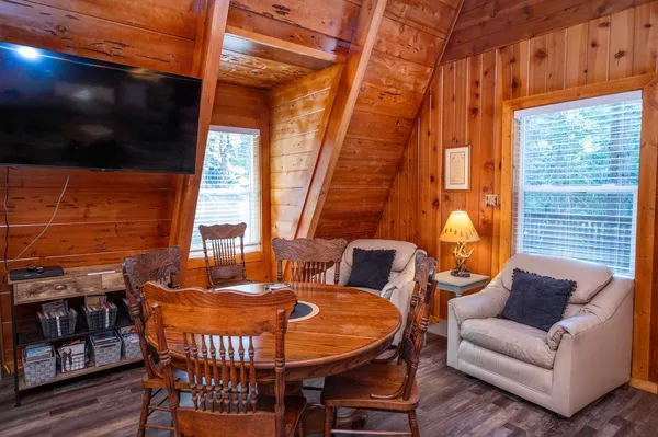 a balcony with furniture and wooden floor