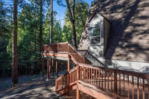 a view of balcony with deck and trees