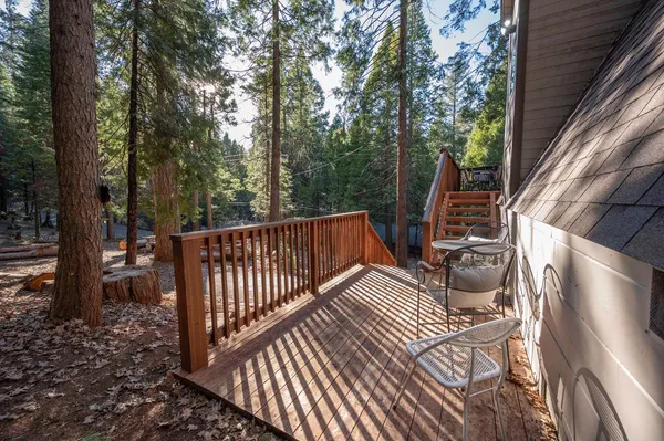 a view of balcony with furniture