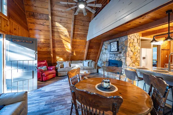 a dining room with furniture and wooden floor