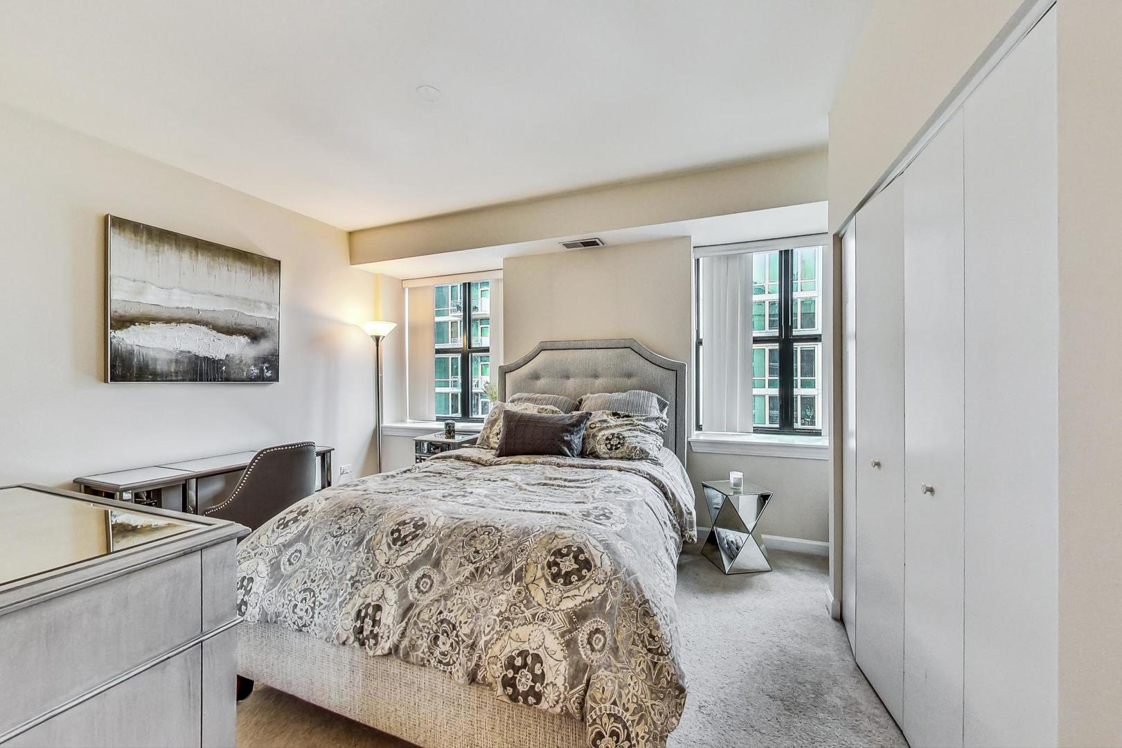 451 West Huron Street, Unit 1201 Chicago, IL 60654 - Photo 9 of 18 a bedroom with a bed and a window