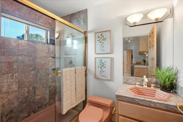 a room with a sink and a mirror