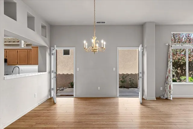 a kitchen with stainless steel appliances granite countertop a sink and cabinets
