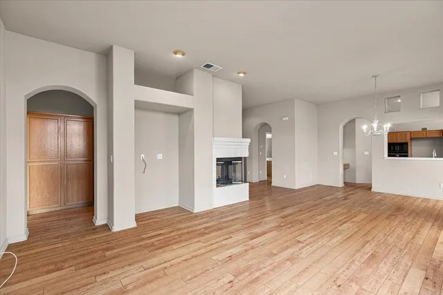 a bathroom with a tub a sink and glass door shower