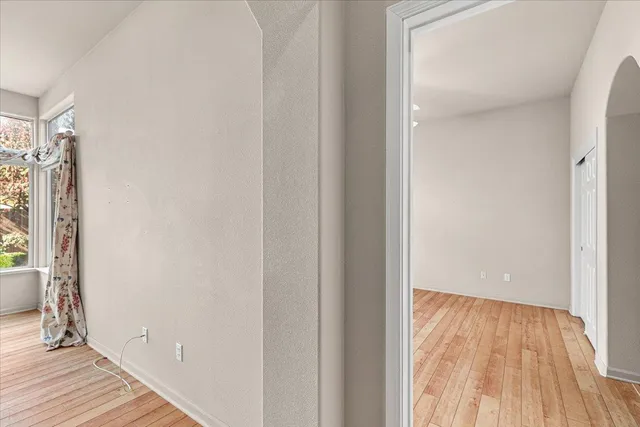 a spacious bathroom with a double vanity sink and mirror
