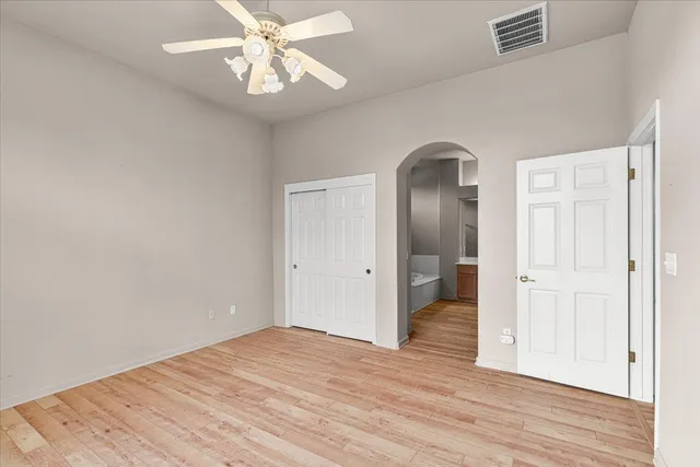 a view of a bedroom from a hallway