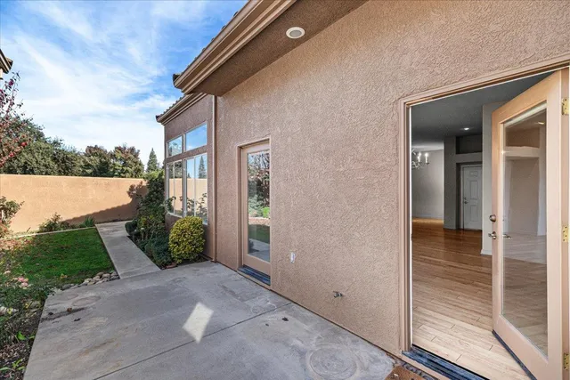a view of a house with garden and trees
