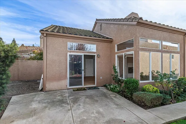 a view of a swimming pool with a yard