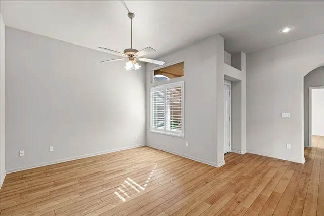 a living room with furniture wooden floor and a fireplace