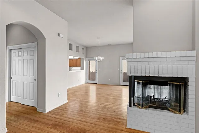 a view of a kitchen with a sink and refrigerator