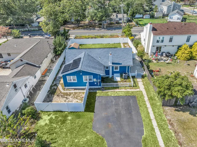 an aerial view of a house with swimming pool