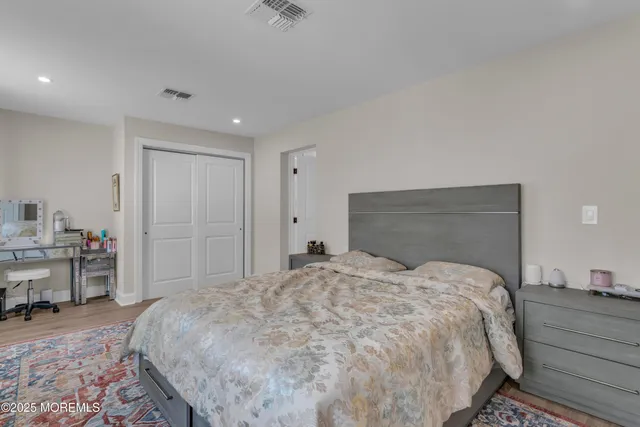 a bedroom with a bed and a cabinets