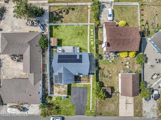 aerial view of a house with a garden and plants