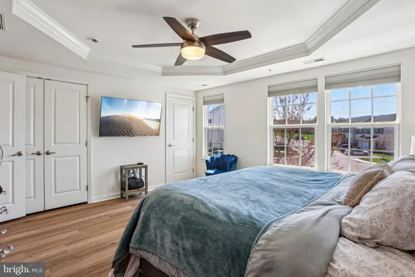 a bed room with a bed and a television
