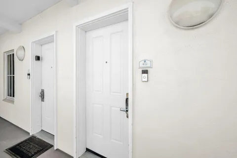 a view of a house with swimming pool and sitting area