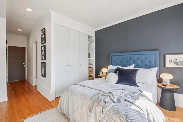 a bedroom with a bed and a walk in closet