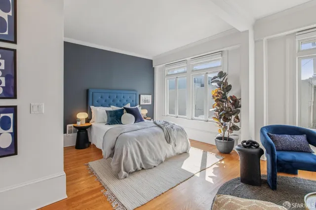 a bedroom with a large bed and a couch