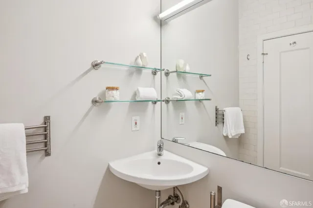 a bathroom with a sink and a mirror