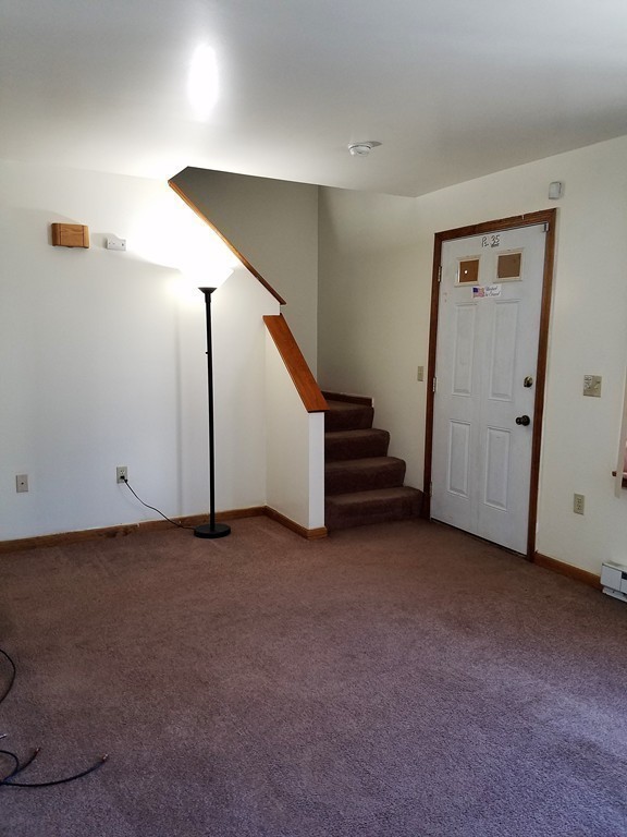 10 A Weldon Avenue Worcester, MA 01607 - Photo 3 of 10 a view of an empty room with stairs