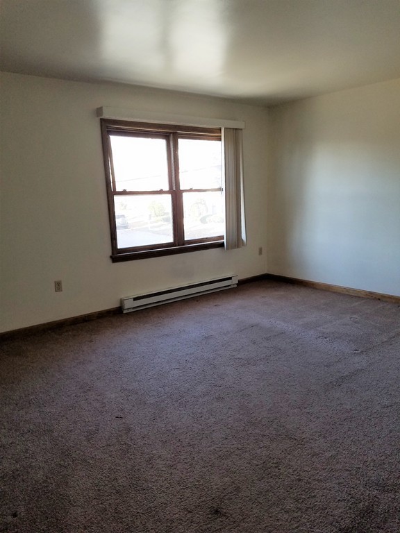 10 A Weldon Avenue Worcester, MA 01607 - Photo 4 of 10 an empty room with a window