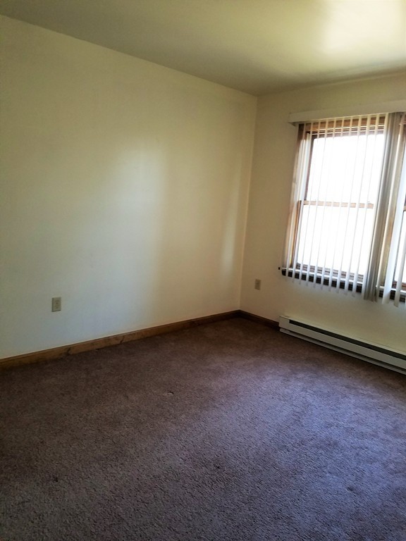 10 A Weldon Avenue Worcester, MA 01607 - Photo 6 of 10 an empty room with a window