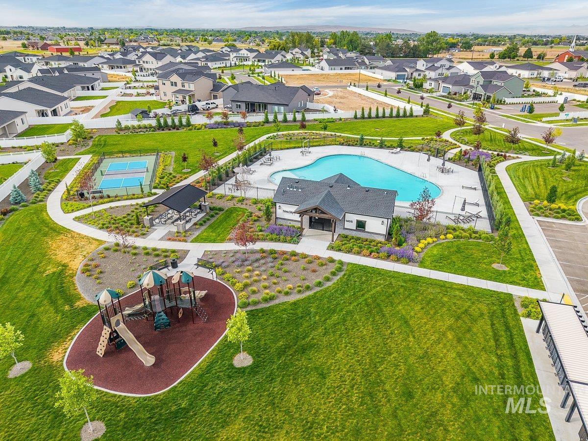 1380 West Chilitna Street Meridian, ID 83642 - Photo 46 of 50 Community amenities featuring a swimming pool, clubhouse, tennis courts, covered picnic area, and playground