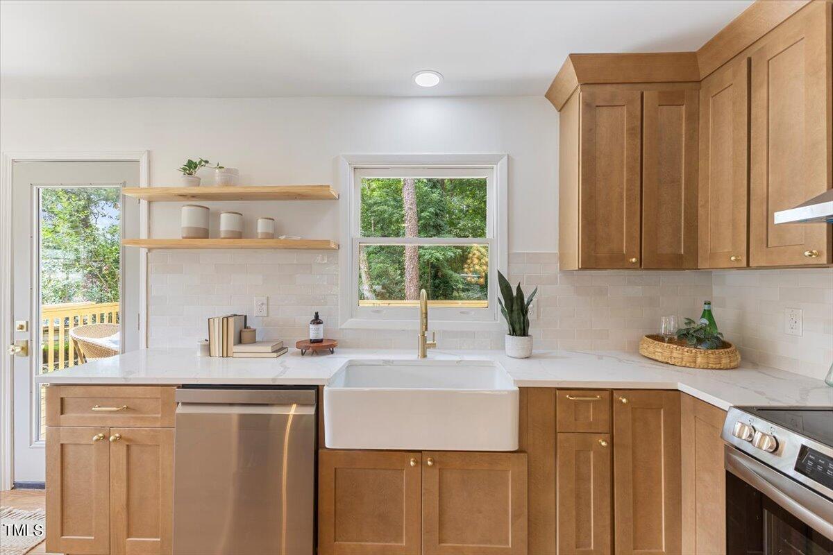 134 Radcliff Circle Durham, NC 27713 - Photo 12 of 37 a kitchen with a sink cabinets and window