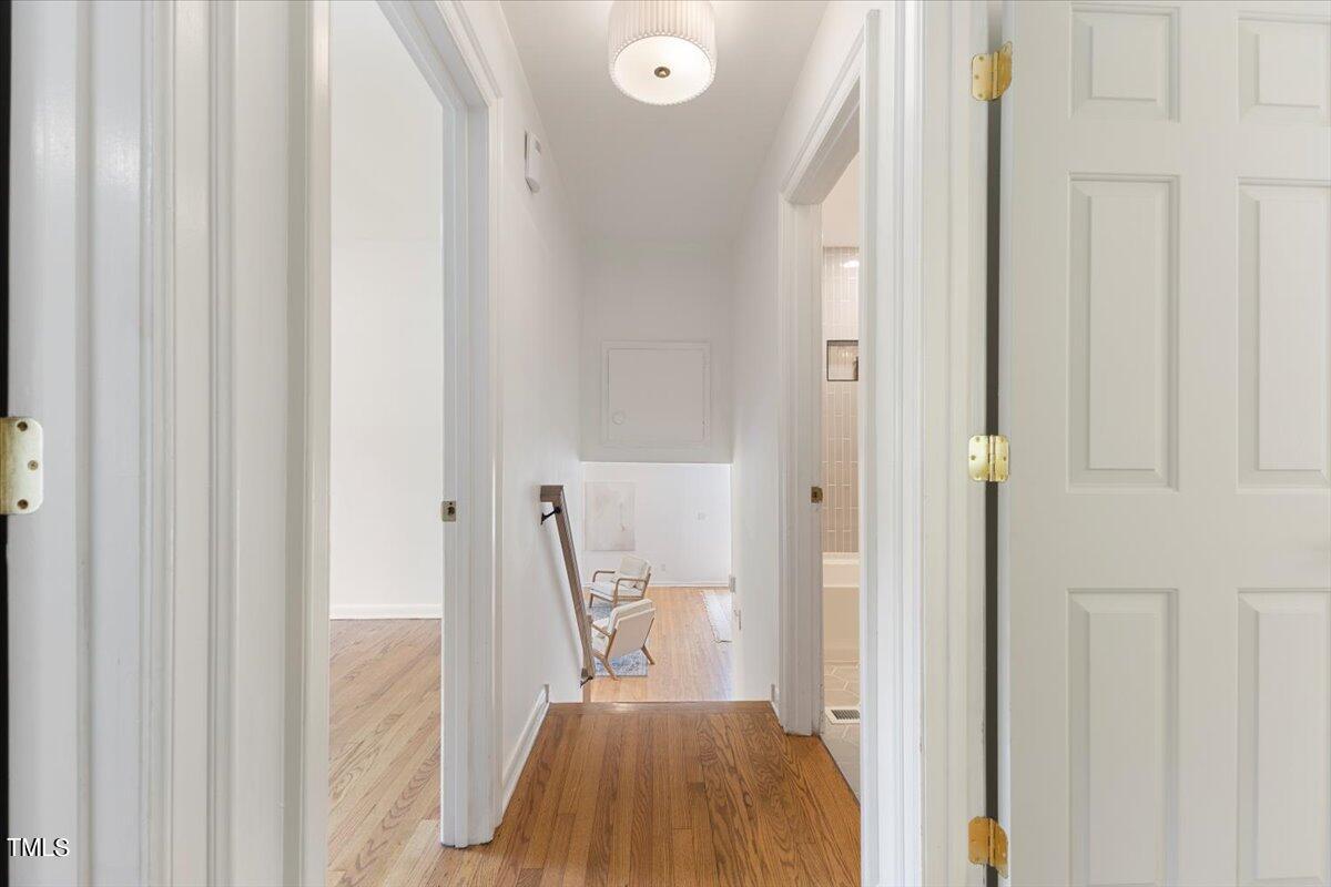 134 Radcliff Circle Durham, NC 27713 - Photo 13 of 37 a view of a hallway with wooden floor and staircase