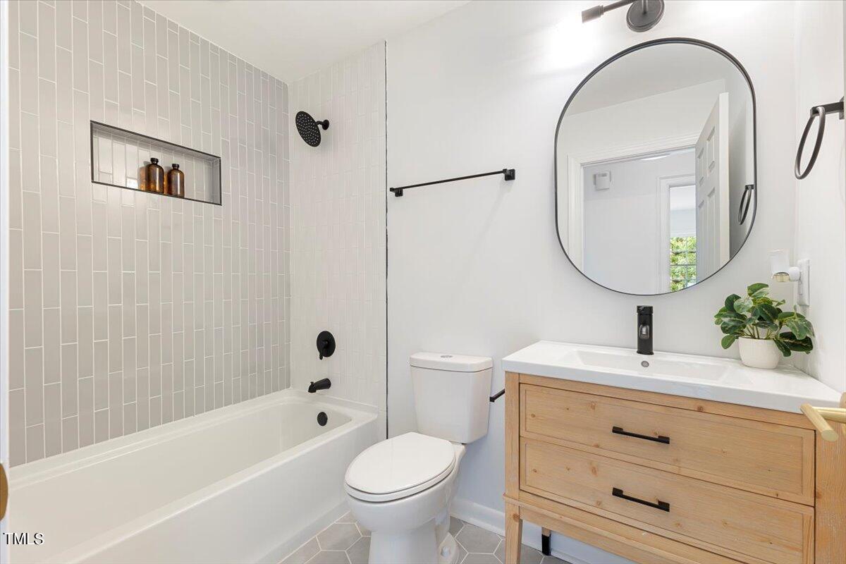 134 Radcliff Circle Durham, NC 27713 - Photo 14 of 37 a bathroom with a sink mirror toilet and bathtub