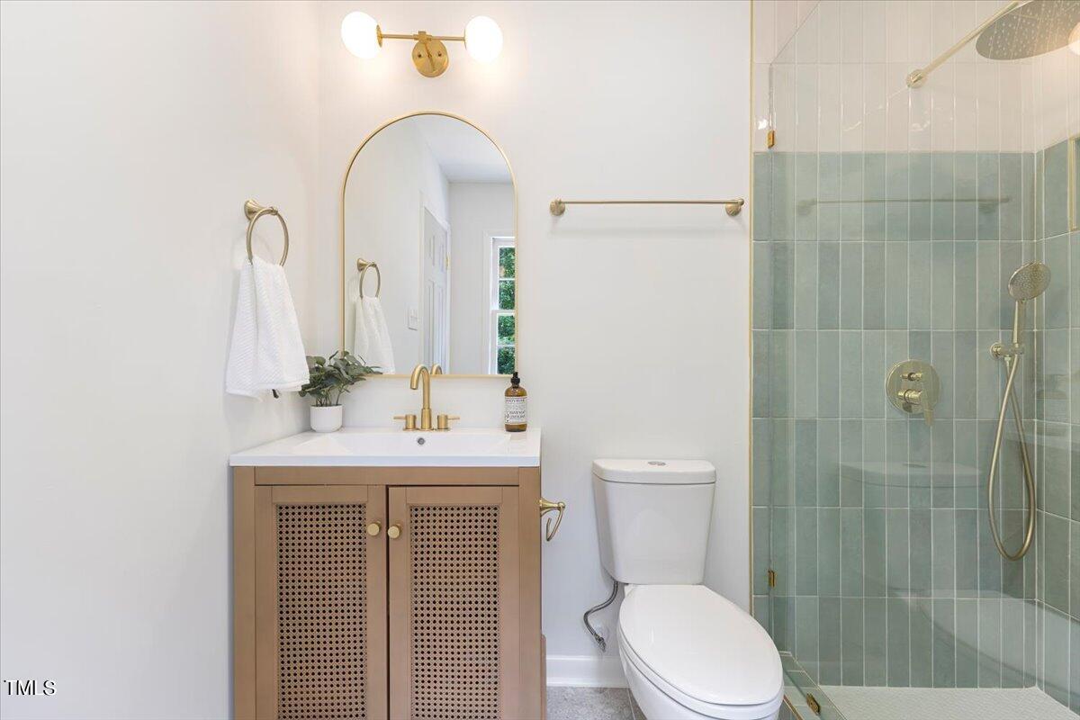 134 Radcliff Circle Durham, NC 27713 - Photo 20 of 37 a bathroom with a sink a toilet and shower