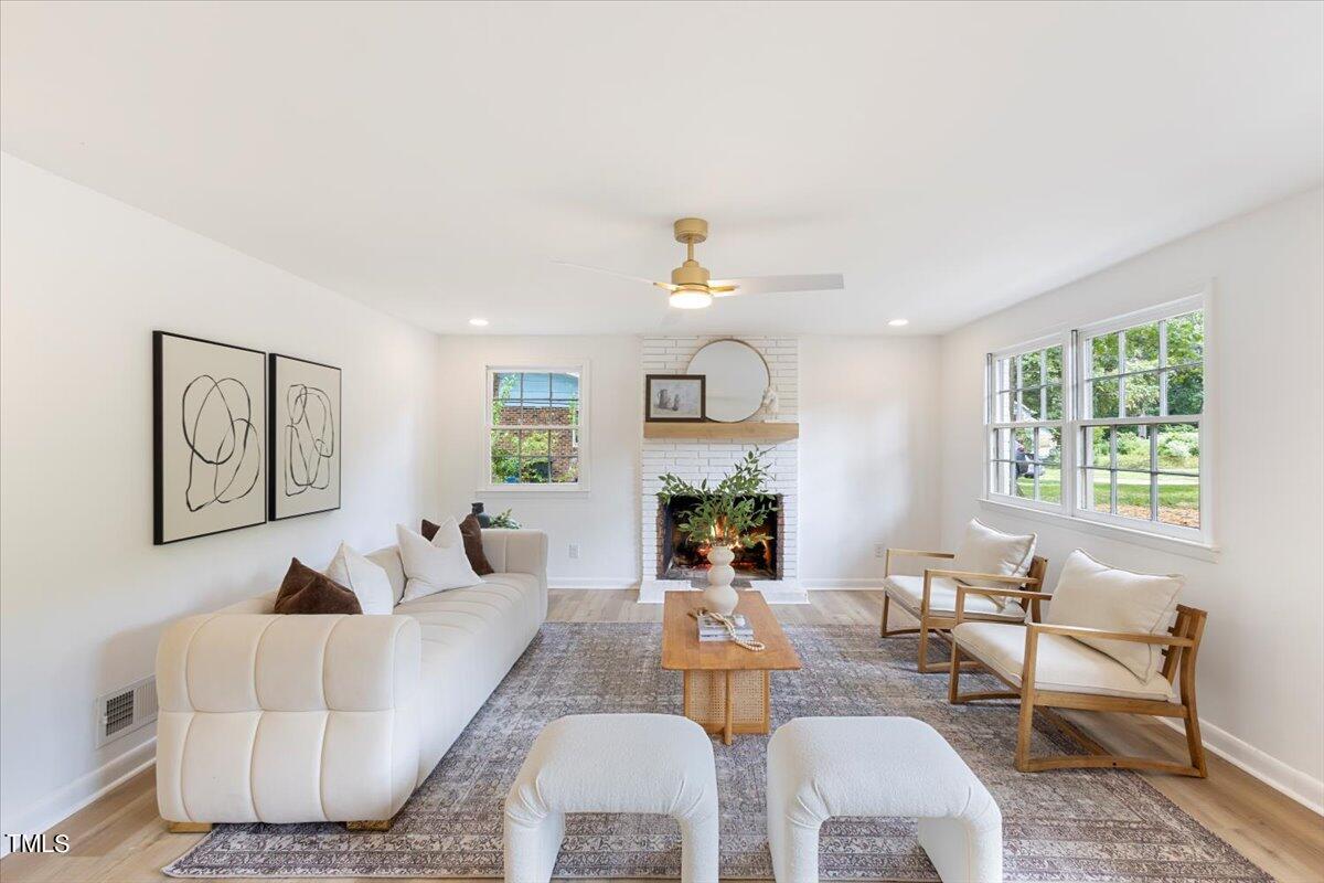 134 Radcliff Circle Durham, NC 27713 - Photo 27 of 37 a living room with furniture and a large window