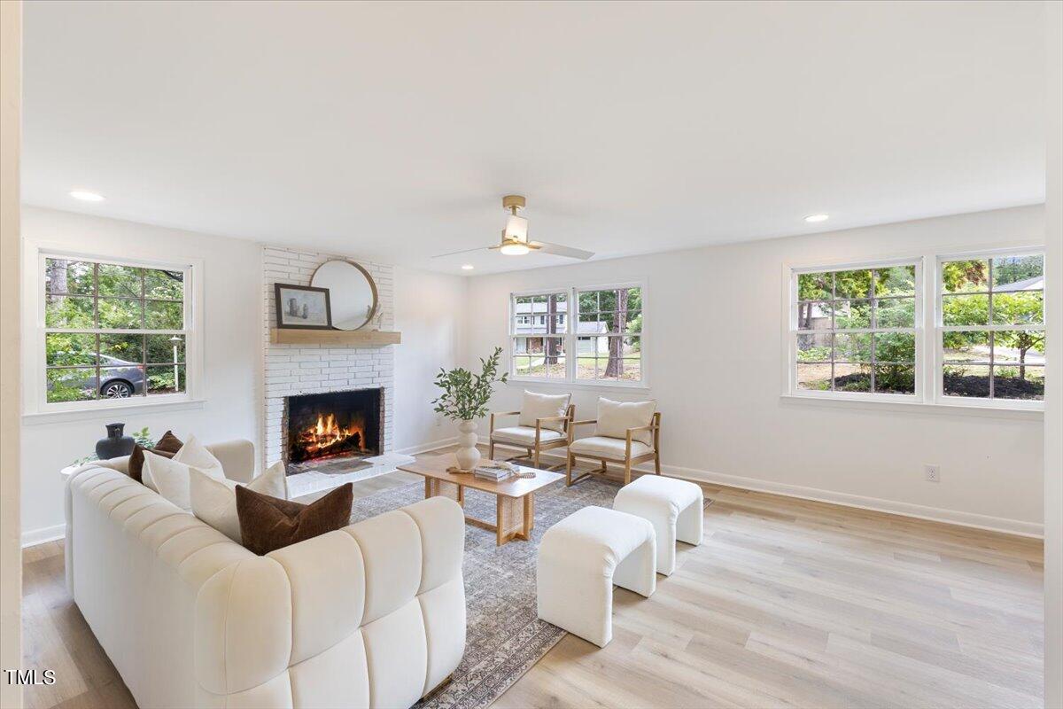 134 Radcliff Circle Durham, NC 27713 - Photo 29 of 37 a living room with furniture and a fireplace