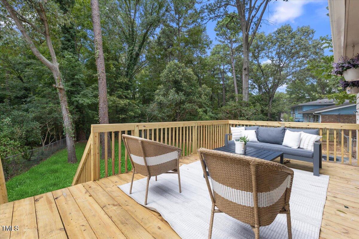 134 Radcliff Circle Durham, NC 27713 - Photo 34 of 37 a view of backyard with a deck and furniture